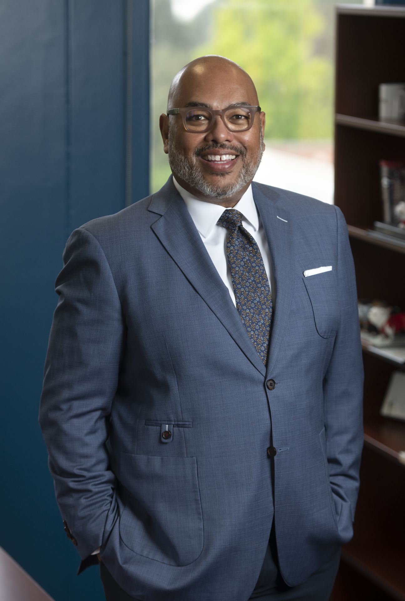 Vice Chancellor of Student Affairs, Dr. Willie Banks, standing and smiling in an office